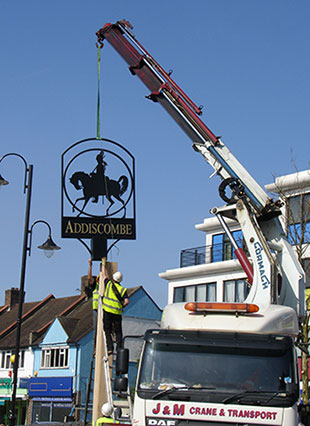Having designed, manufactured and installed many village signs over the years, usually on the village green or by the road side using two or three men, appropriate hand tools and some scaffolding, occasionally a large, in this case Croydon Council, commission comes our way that requires a lot more planning, organisation and heavy machinery.