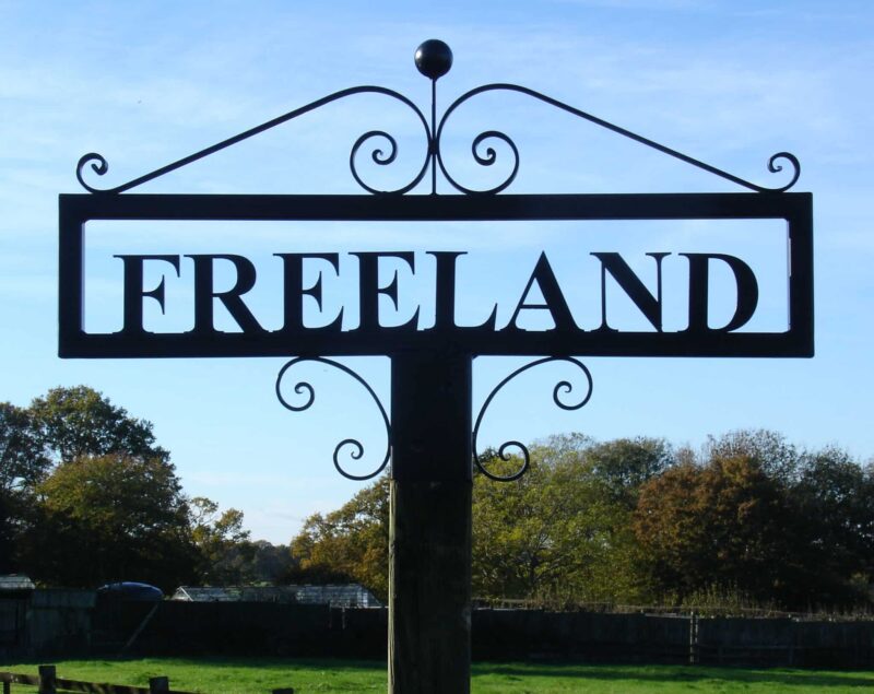 Hot Forged Metal Name Sign Atop Post