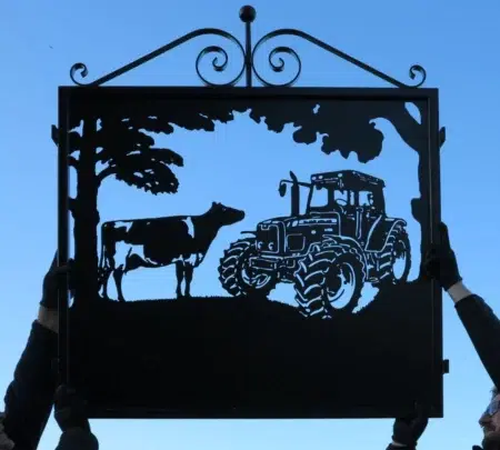Tractor With Dairy Cow Framed Metal Sign With Scrolls Atop