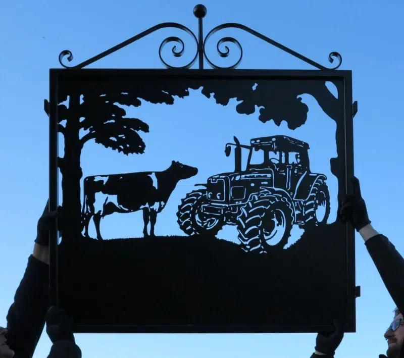 Tractor With Dairy Cow Framed Metal Sign With Scrolls Atop